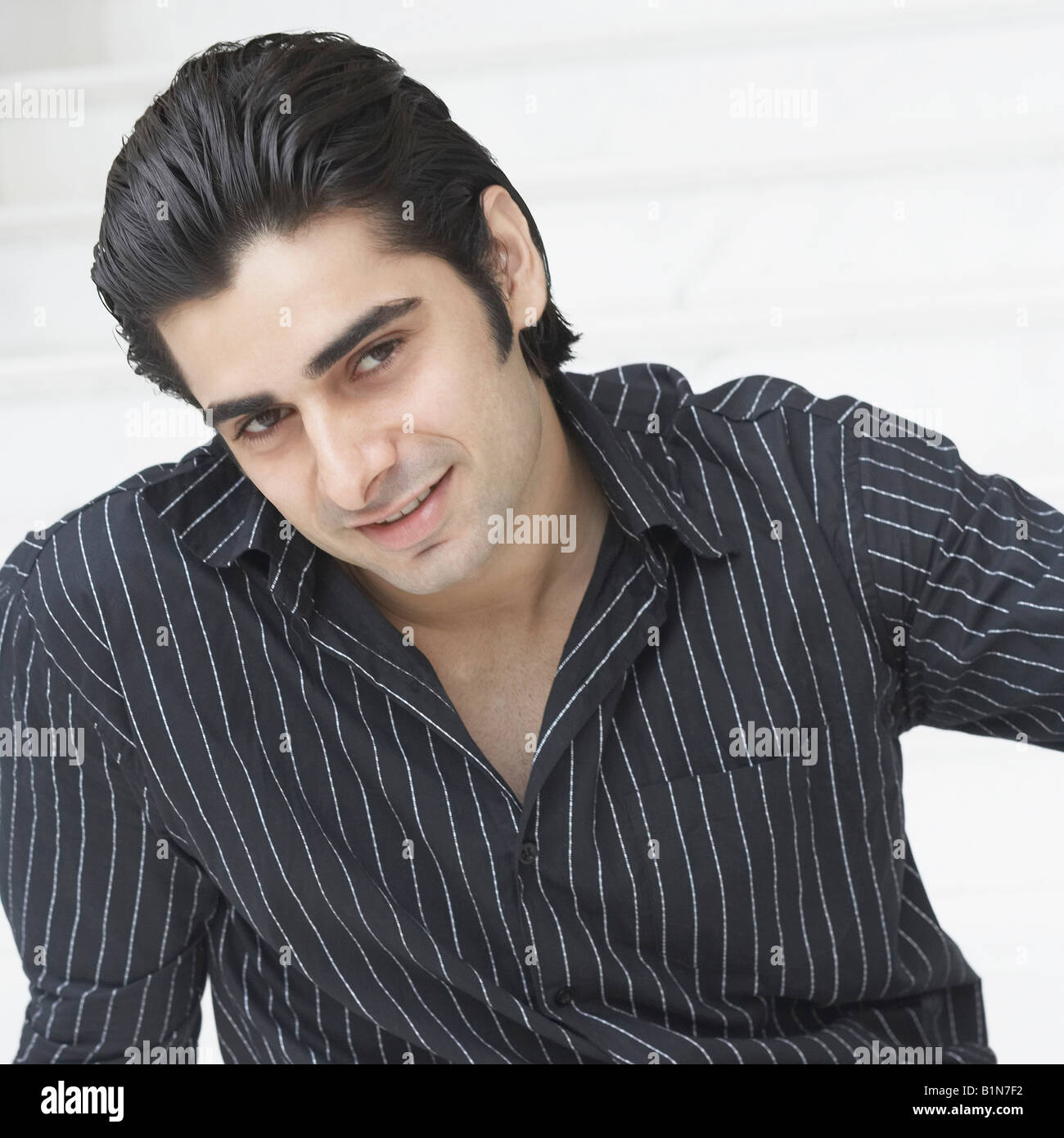 Portrait of a young man smiling Stock Photo - Alamy