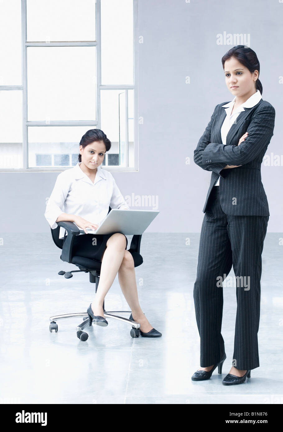Two businesswomen in an office Stock Photo - Alamy
