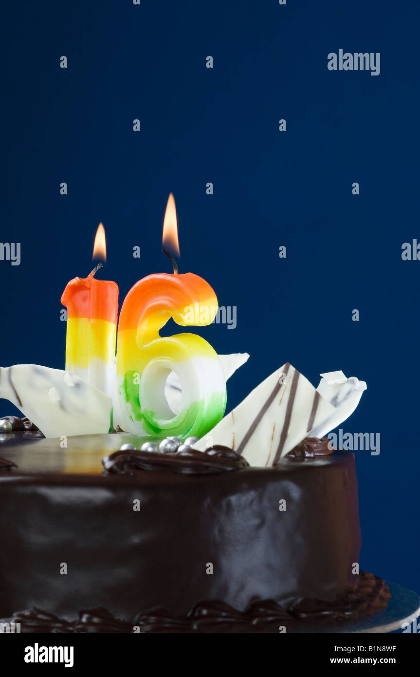 Close-up of lit candles on a birthday cake Stock Photo - Alamy