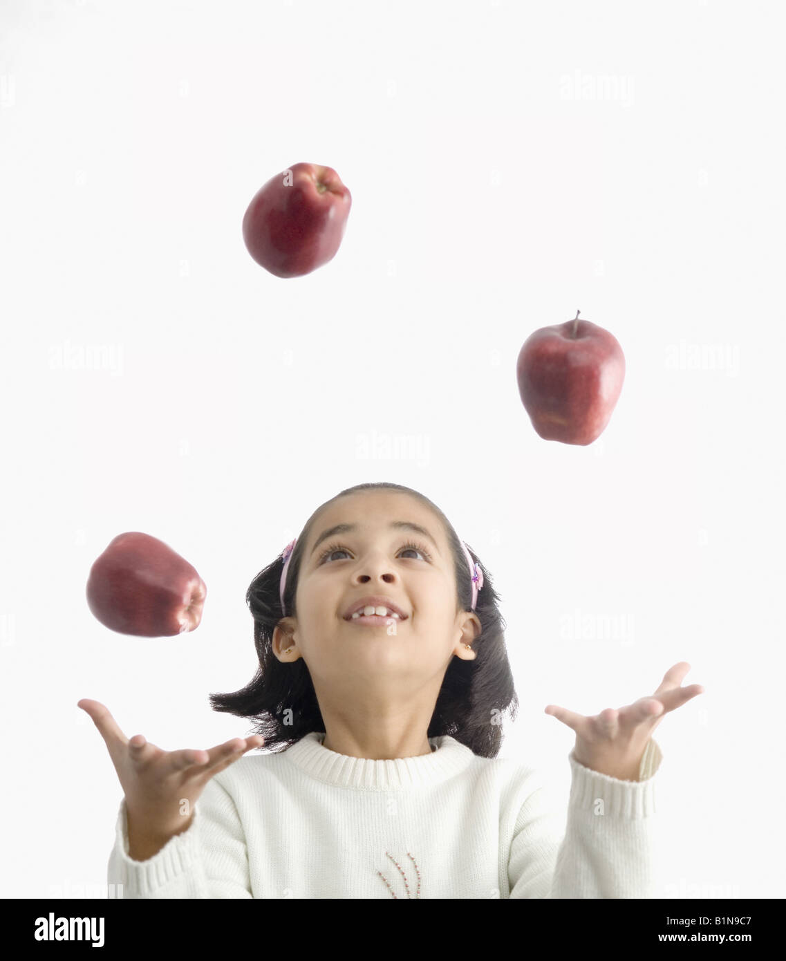 Girl juggling with apples Stock Photo Alamy