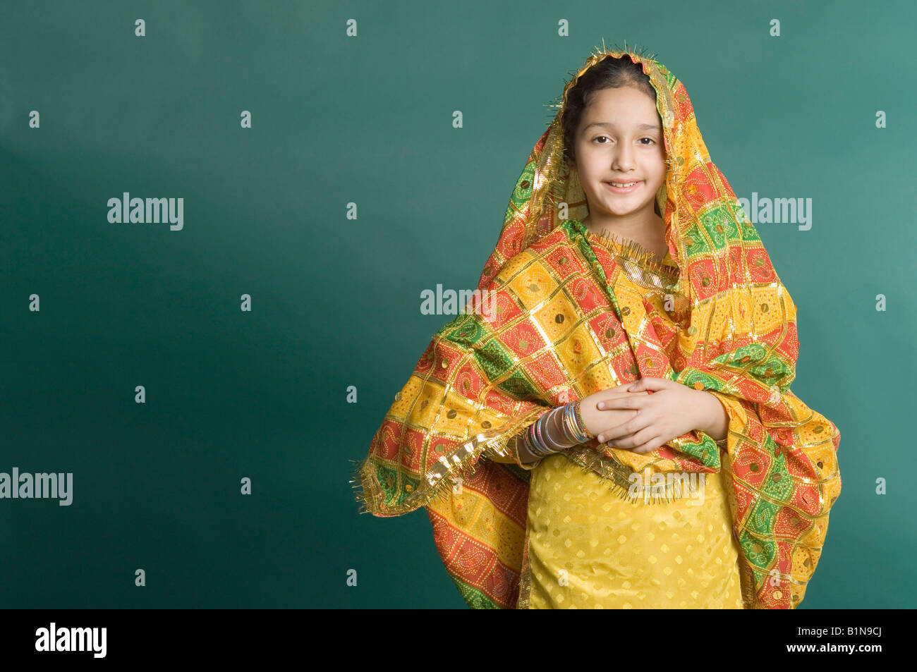 Portrait of a girl wearing traditional clothing and smiling Stock Photo ...