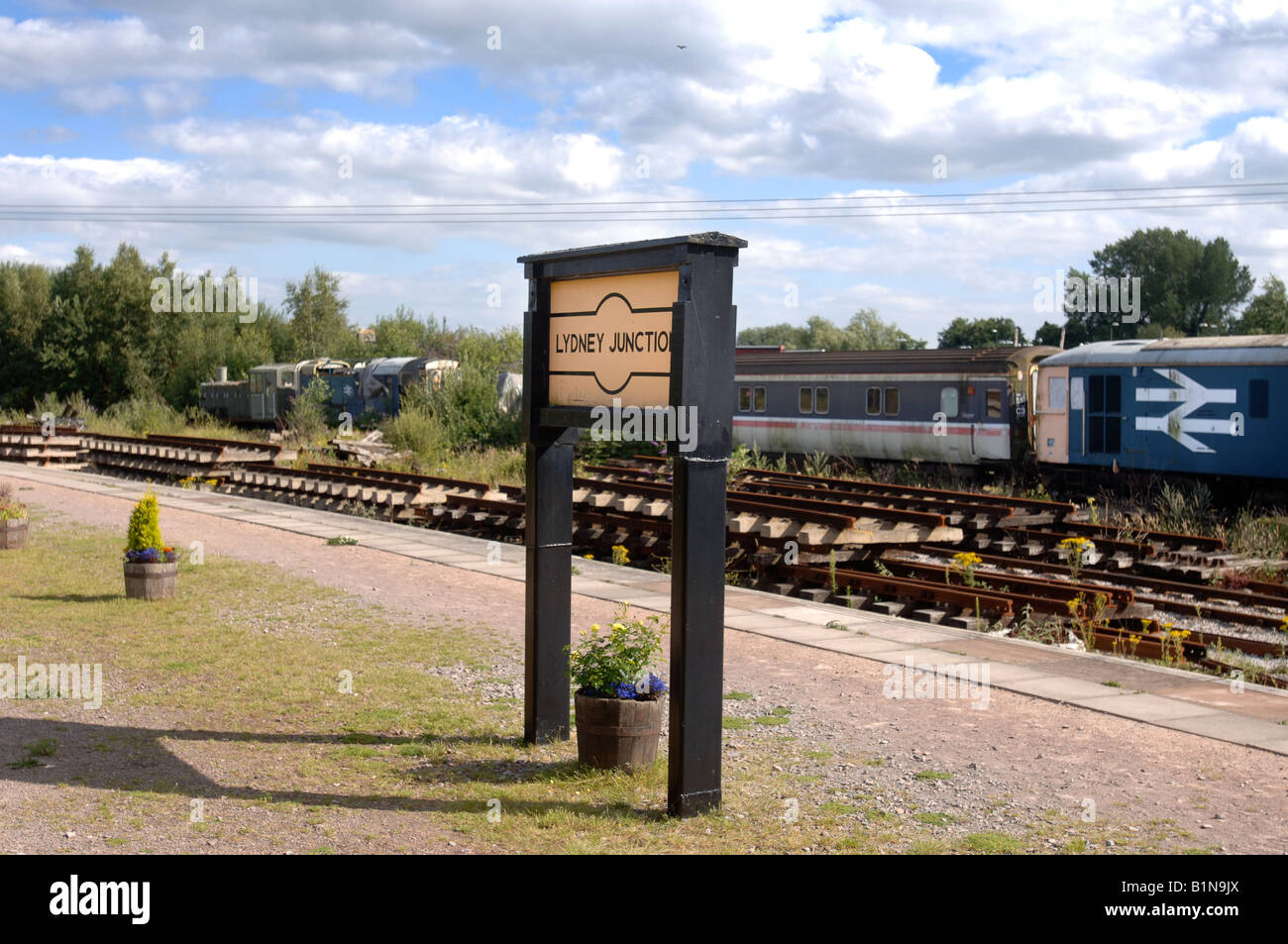 AN OLD ENGINE AND RAILWAY CARRIAGES AT LYDNEY JUNCTION STATION an-old-engine-and-railway-carriages-at-lydney-junction-station