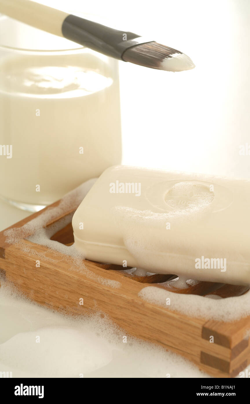 Bar of yoghurt soap with yoghurt and a brush Stock Photo Alamy