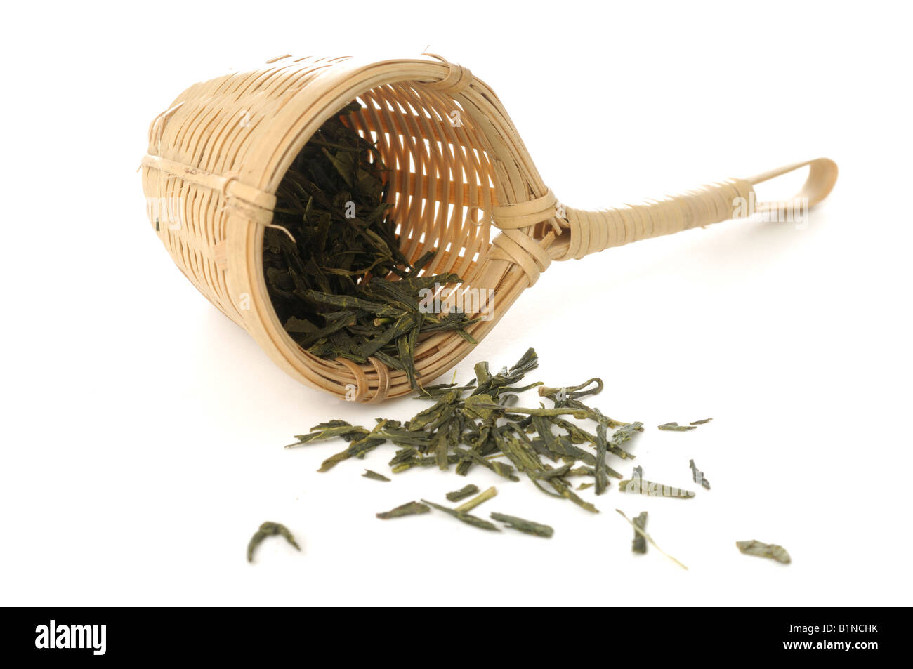 Bamboo tea strainer with green tea Stock Photo Alamy