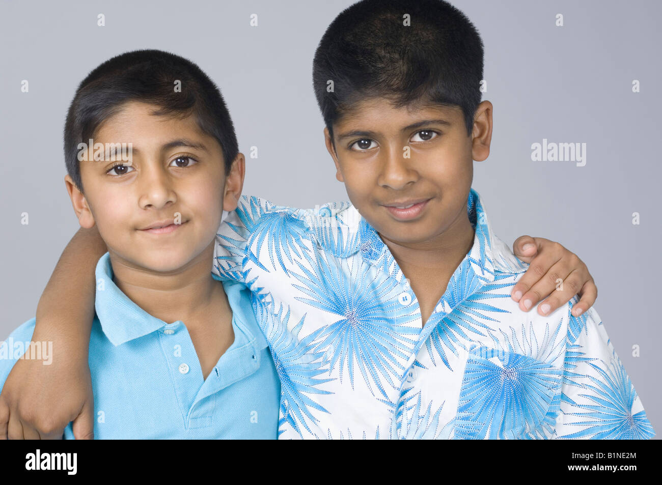 Portrait of two boys smiling with their arms around each other Stock ...