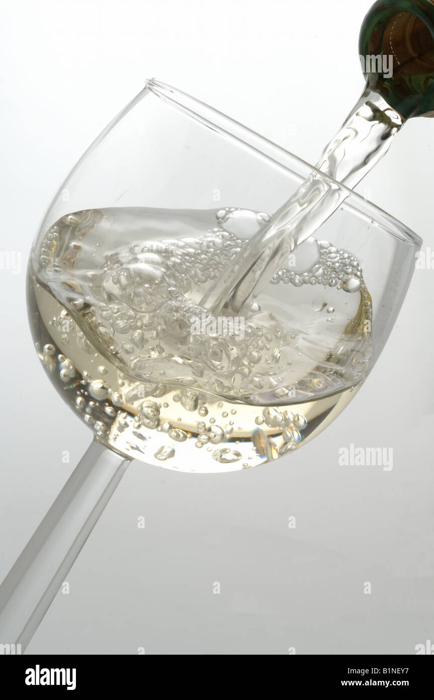 Pouring wine into a wine glass Stock Photo - Alamy