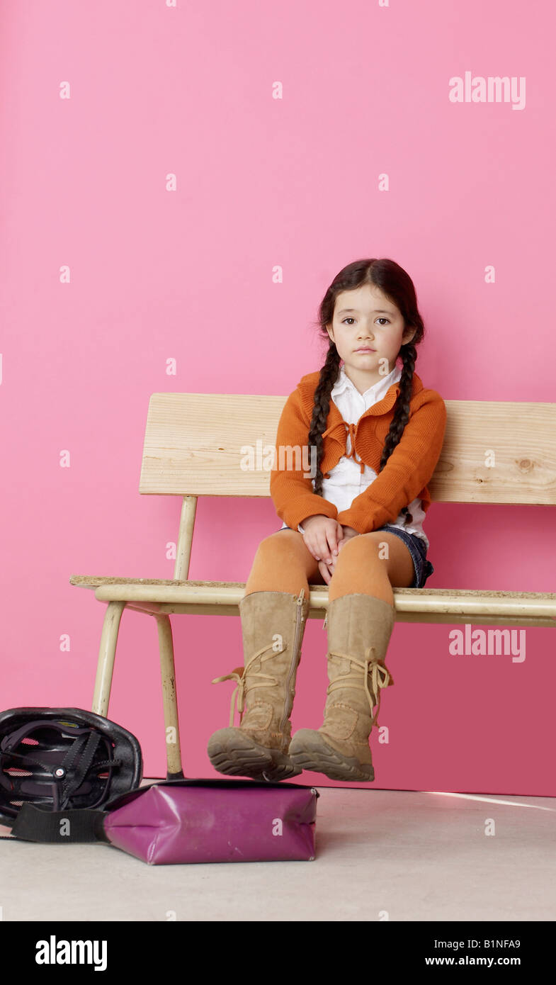 School girl sitting on bench hi-res stock photography and images - Alamy