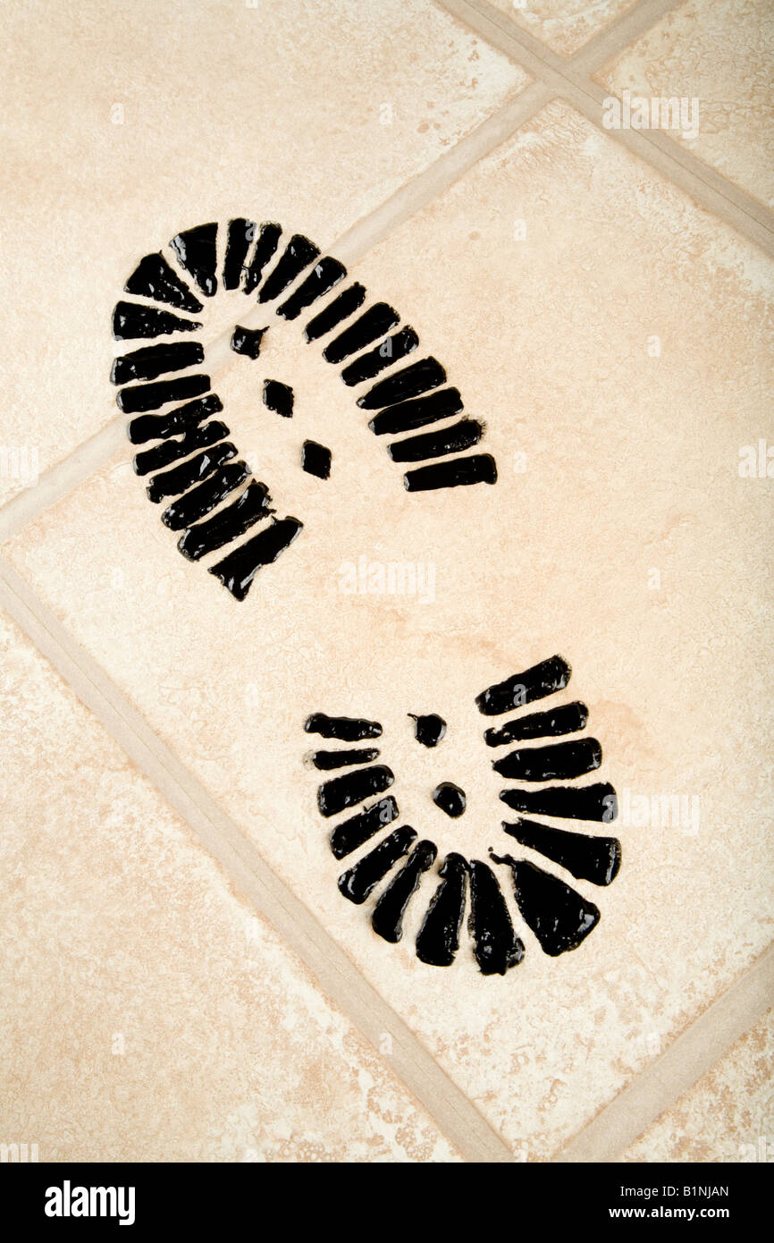A carbon footprint on a laminate floor Stock Photo