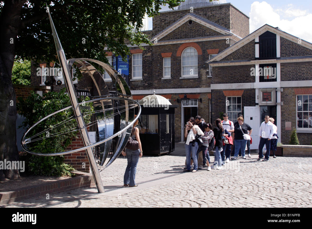 Tourists photographing eachother at the Prime Meridian Line Royal Observatory Greenwich June 2008 Stock Photo
