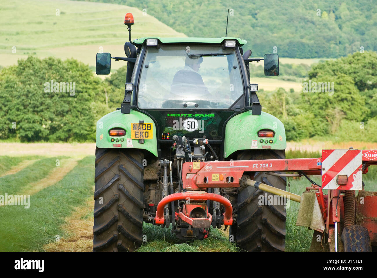 Deutz Fahr Agrotron 180 7 tractor manufactured in Italy cutting silage in a Wiltshire field Stock Photo