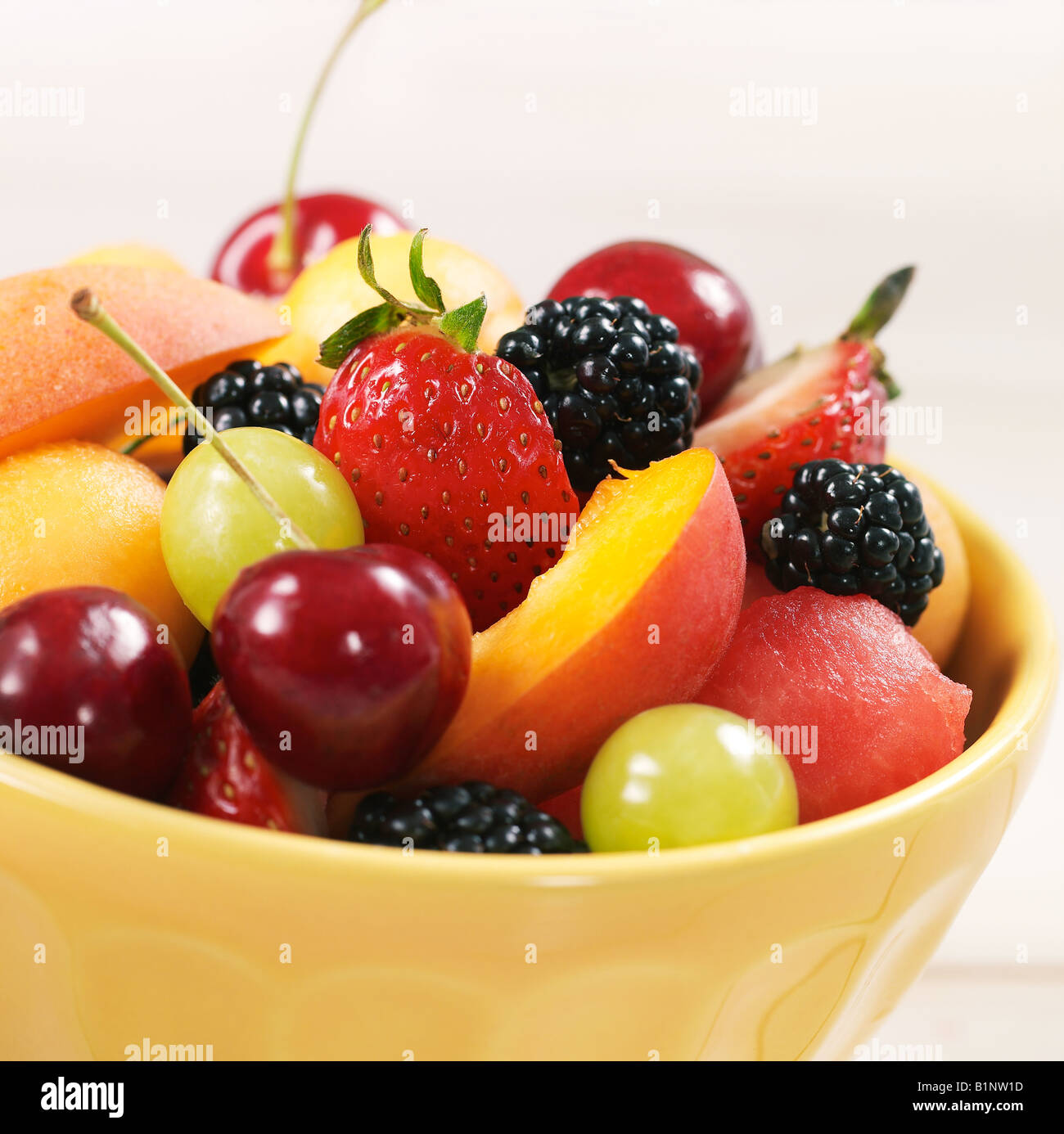 Studio shot of a bowl of mixed fruit in an environment Stock Photo Alamy