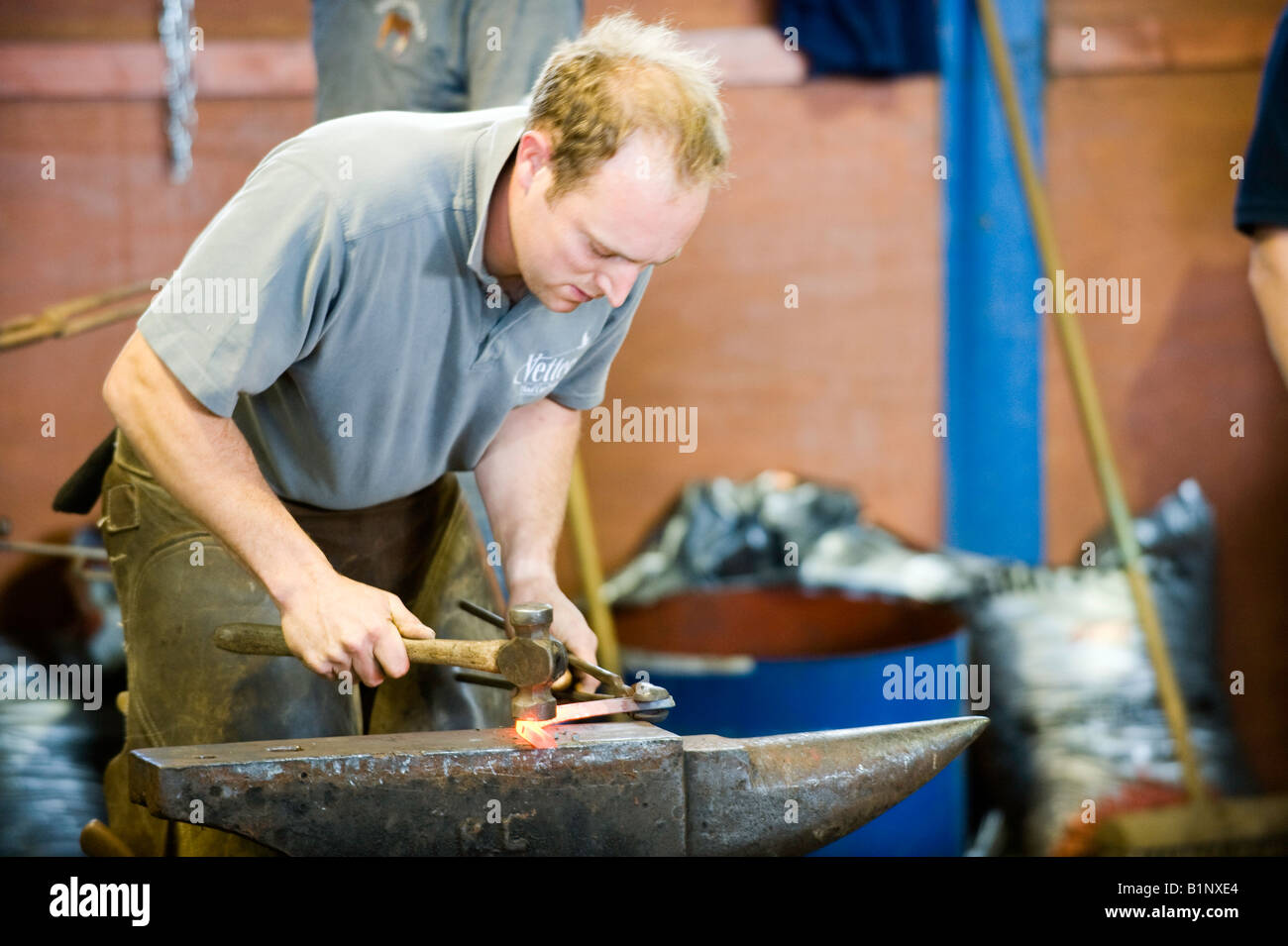 Farrier making horse shoe on anvil Edinburgh Stock Photo Alamy