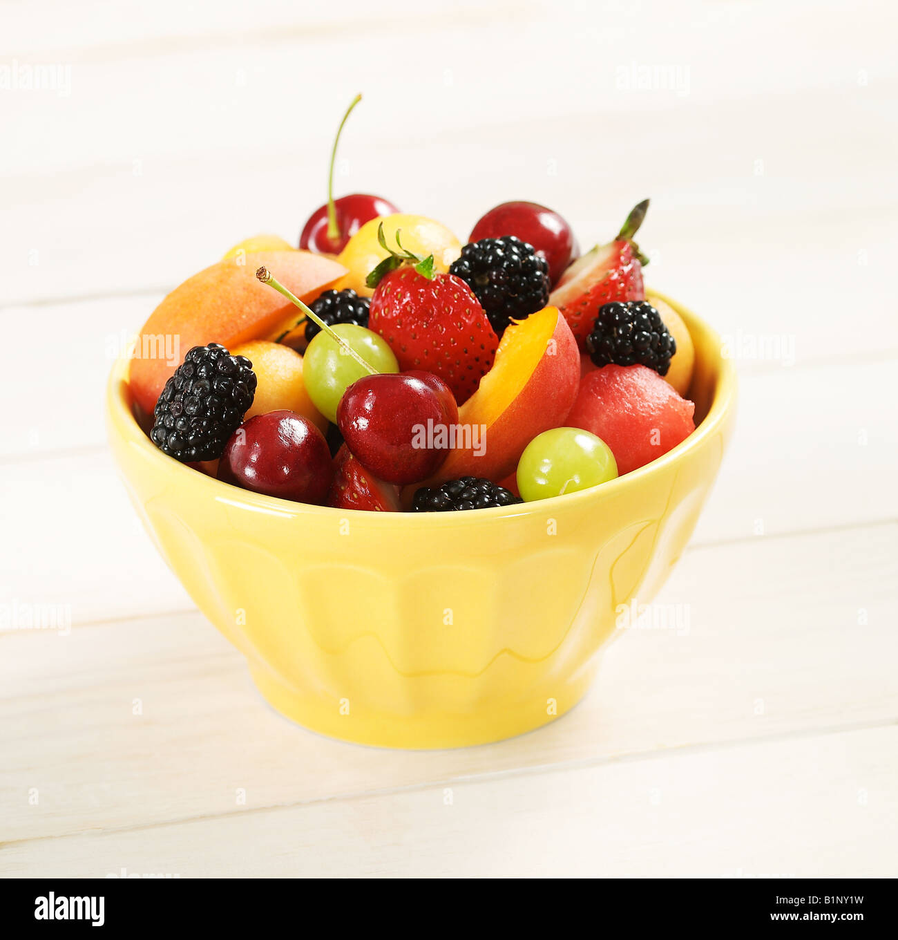 Studio shot of a bowl of mixed fruit in an environment Stock Photo Alamy