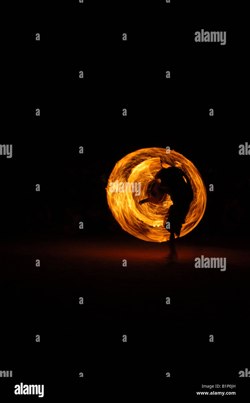 Fire twirling (poi) on ton sai beach Thailand Stock Photo