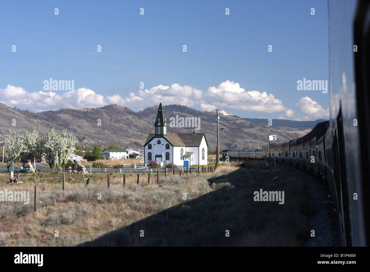 Canada rocky mountaineer train passing a church canada Stock Photo - Alamy