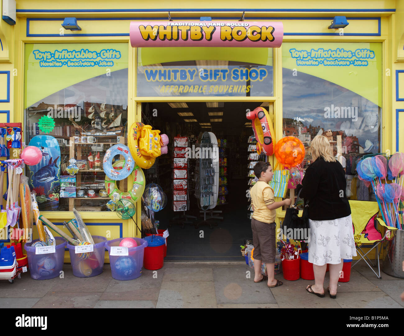 ROCK AND TOY SHOP ON HARBOUR SIDE WHITBY VILLAGE SUMMER NORTH YORKSHIRE