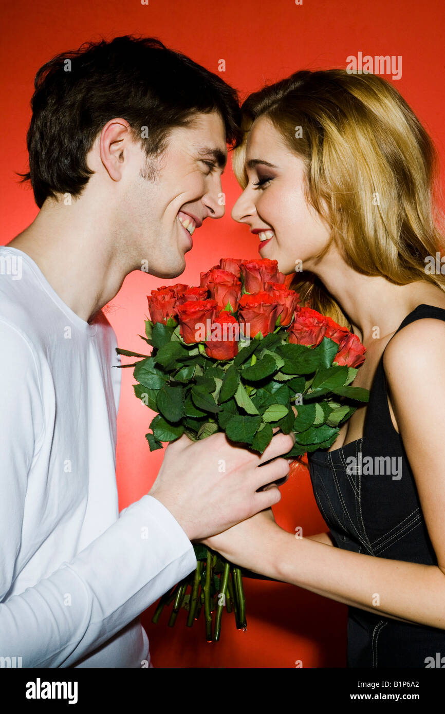 Red Roses Couple 25 beauty couple emotion feelings girl in love interior hi-res stock ...