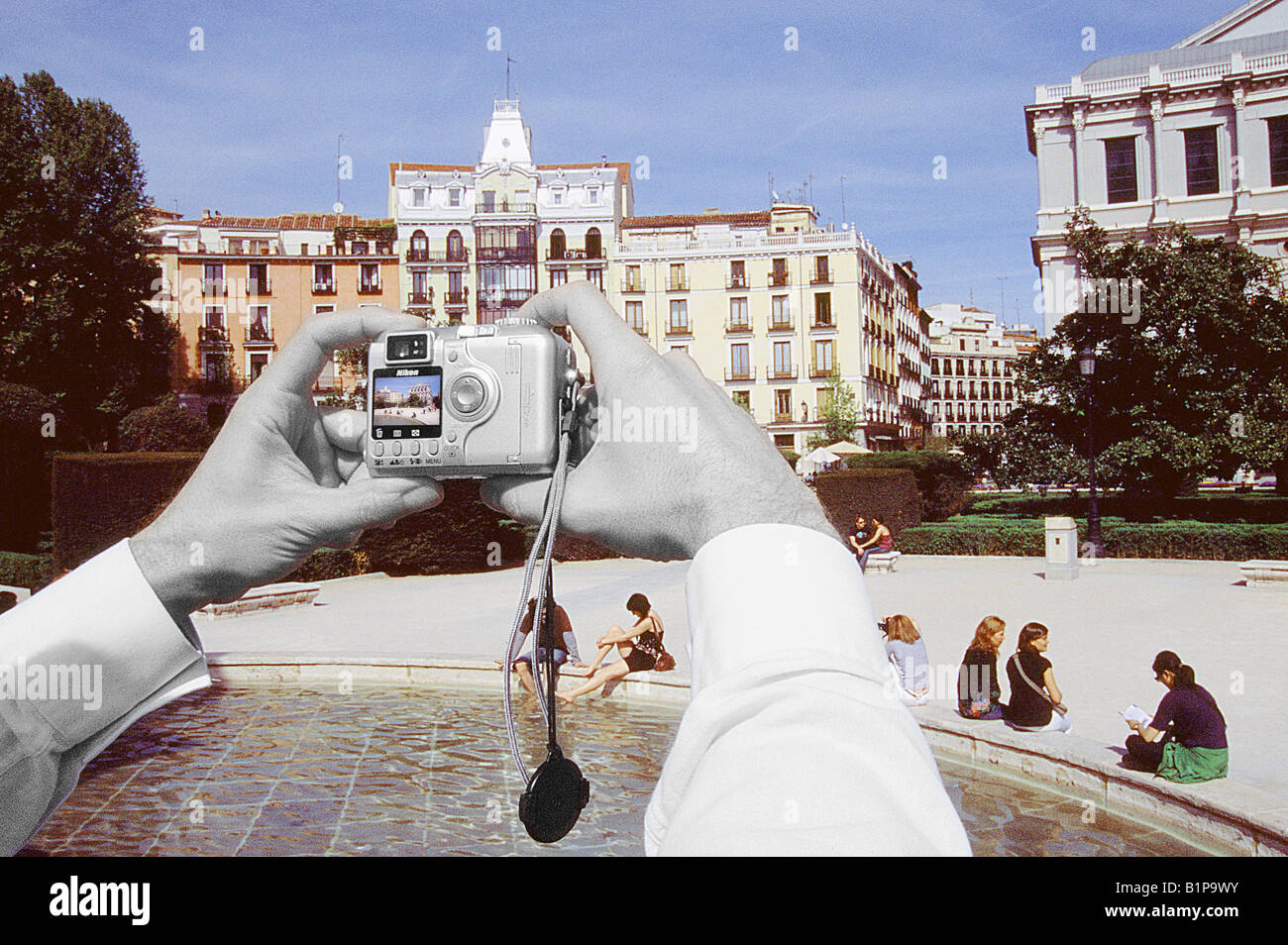 Hands taking photograph of the Oriente Square. Madrid. Spain. Stock Photo