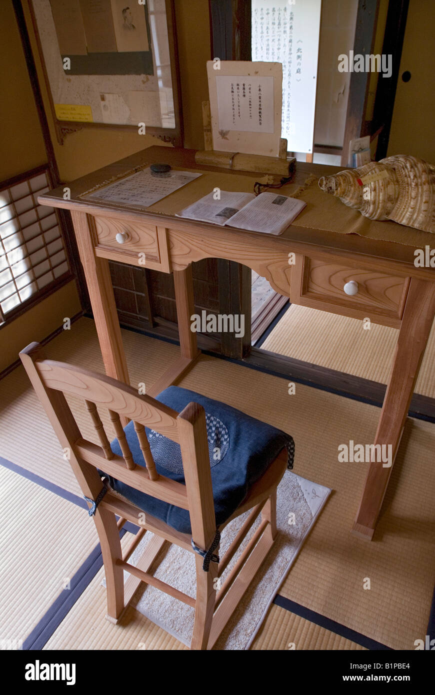 Writing desk and chair of Lafcadio Hearn also known as Koizumi Yakumo at his house in Matsue Japan Stock Photo