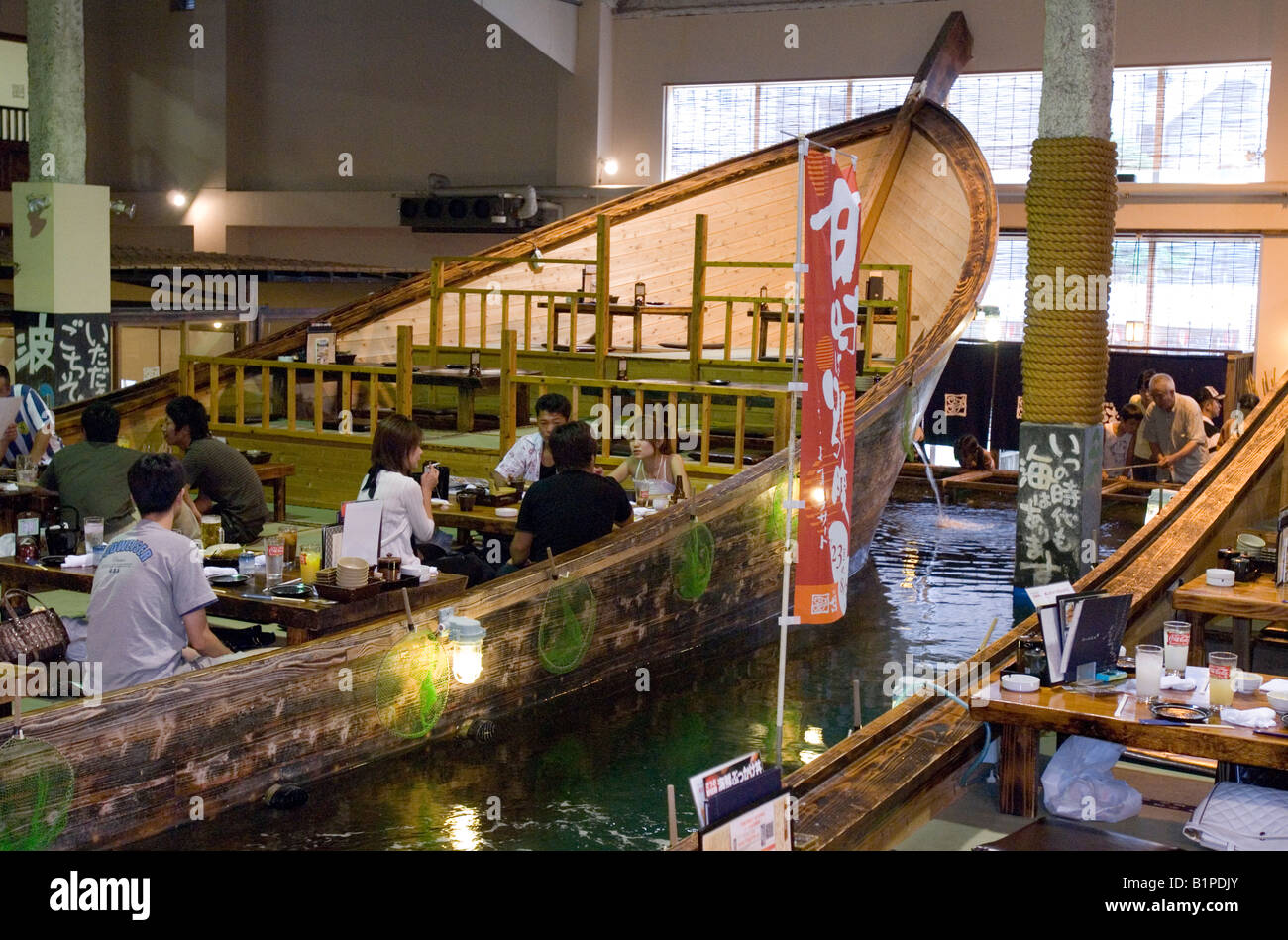 Customers At Zauo Restaurant In Fukuoka Japan Can Fish For Their Meal Directly From Their Table Inside A Boat Stock Photo Alamy