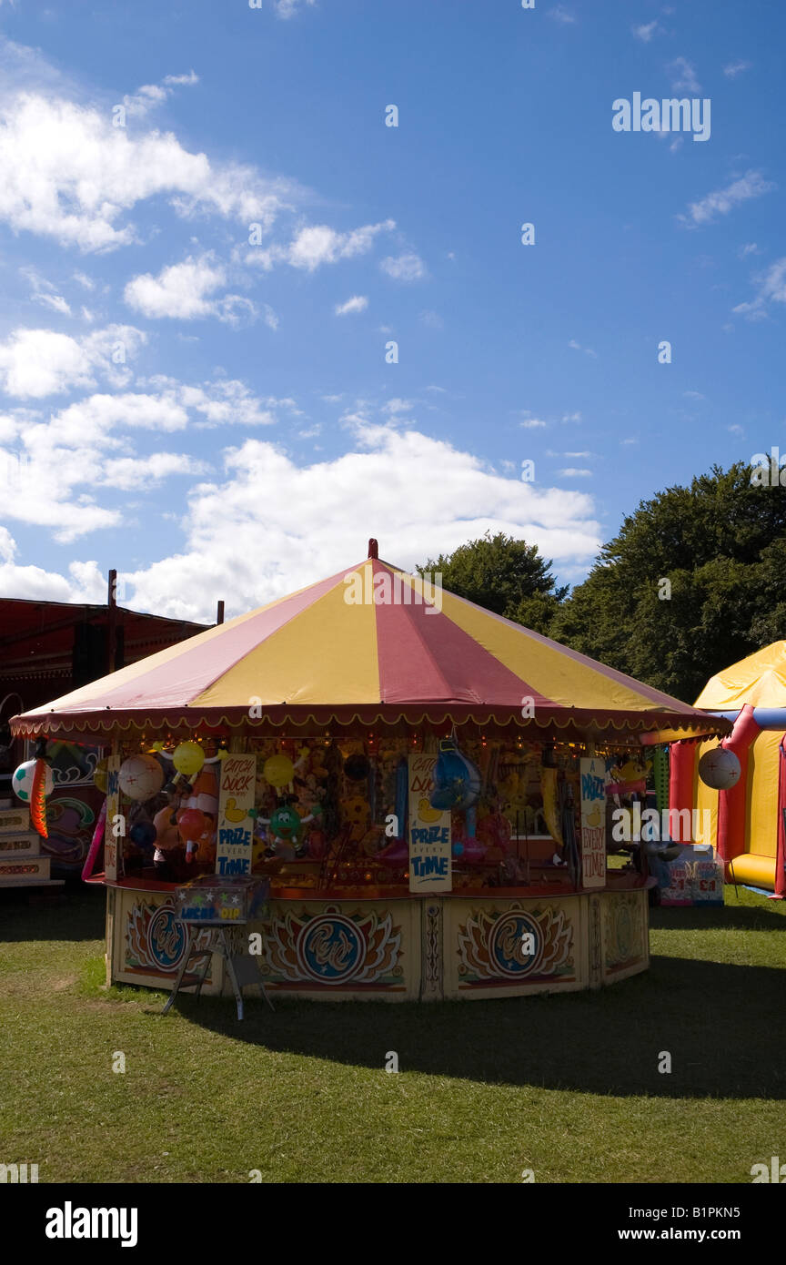 Hook a duck game at a fair stock photo alamy
