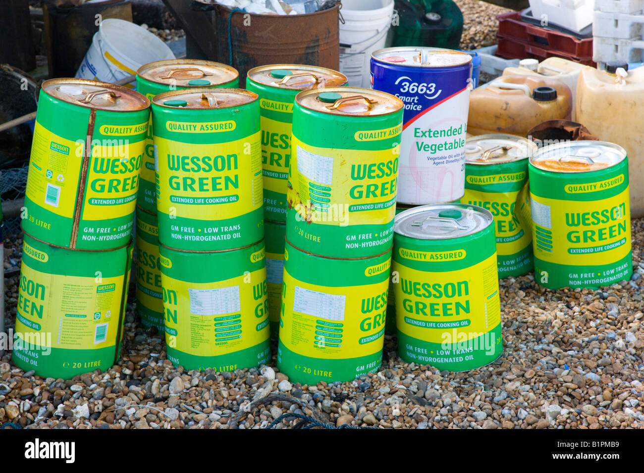 Drums of cooking oil on the beach used as a diesel fuel substitute in