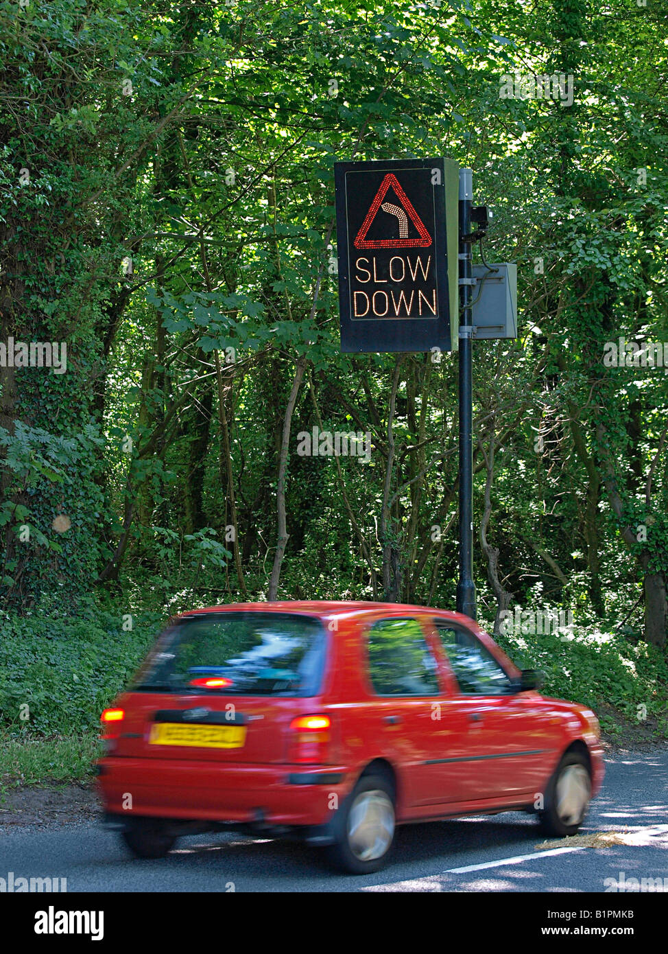 TRAFFIC CALMING ELECTRONIC SLOW DOWN SIGN AT DANGEROUS BEND RURAL ROAD FELBRIGG TO NORTH WALSHAM,  NORFOLK ENGLAND UK Stock Photo