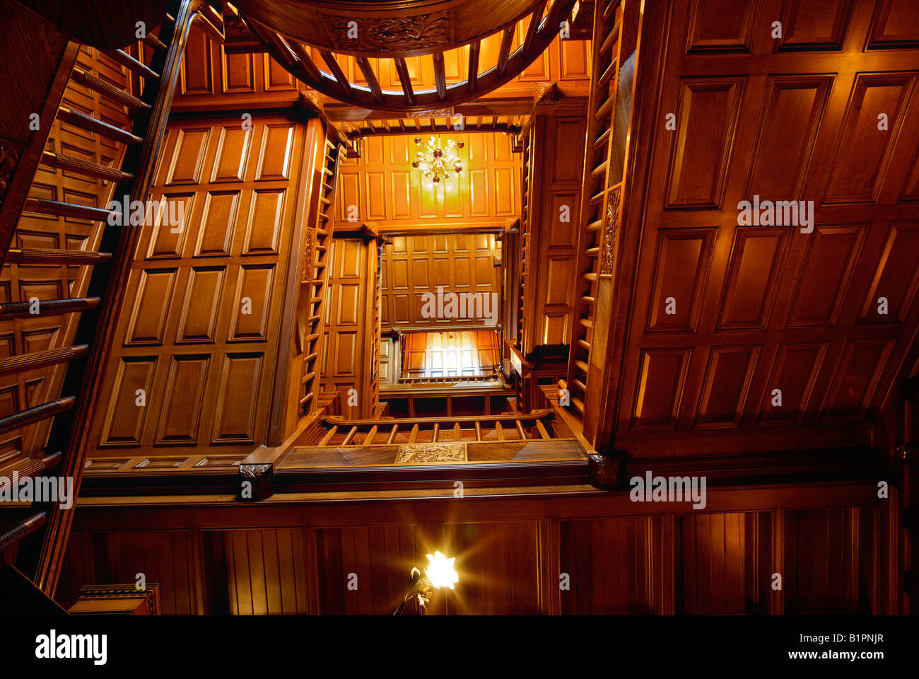 The magnificent Arkansas oak staircase at Craigdarroch castle in Victoria BC Stock Photo