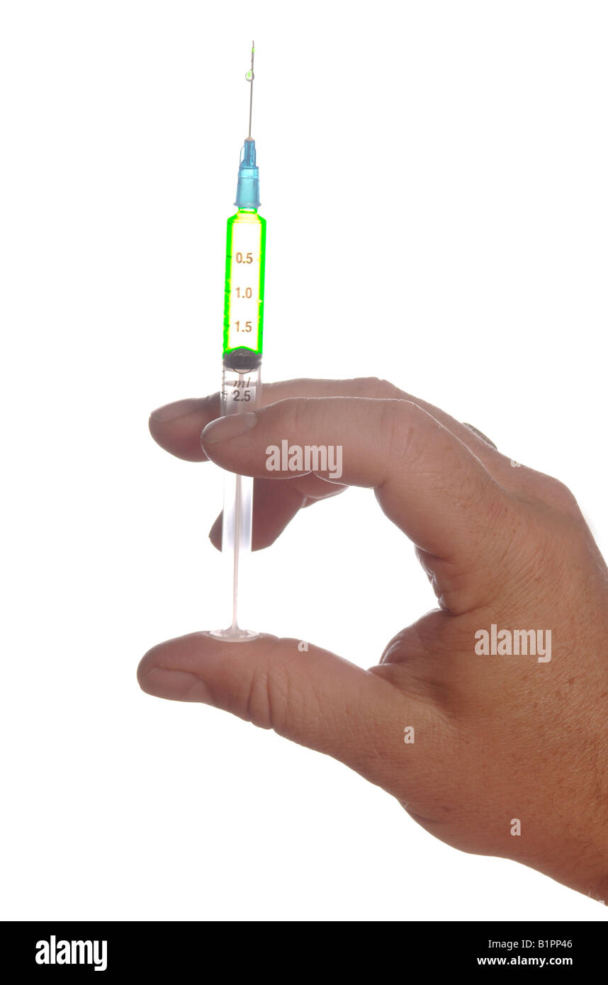 a person holding an hyperdermic needle Stock Photo - Alamy