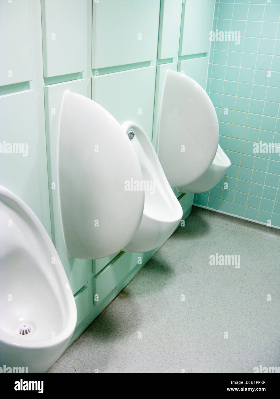 White urinals on wall in Men's toilet Stock Photo