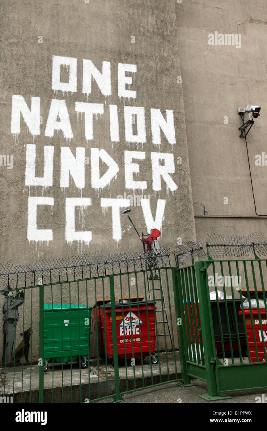 Political graffiiti by Banksy, showing how we in the UK are part of a surveillance society spied on by millions of CCTV cameras. Stock Photo