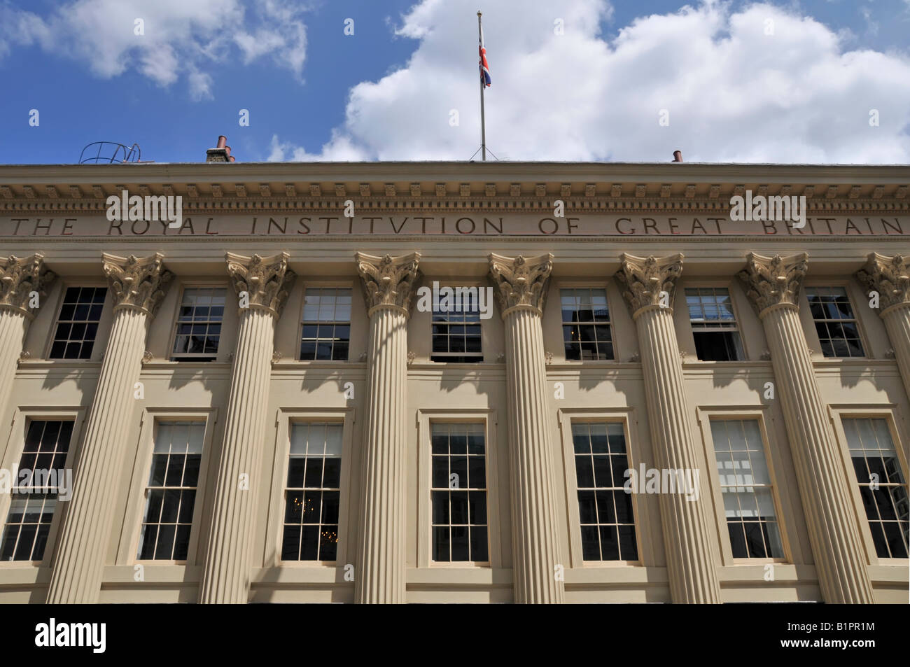 Royal Institution of Great Britain & Faraday Museum building facade at  roof level a colonnade Corinthian capitals Albemarle Street London England UK Stock Photo