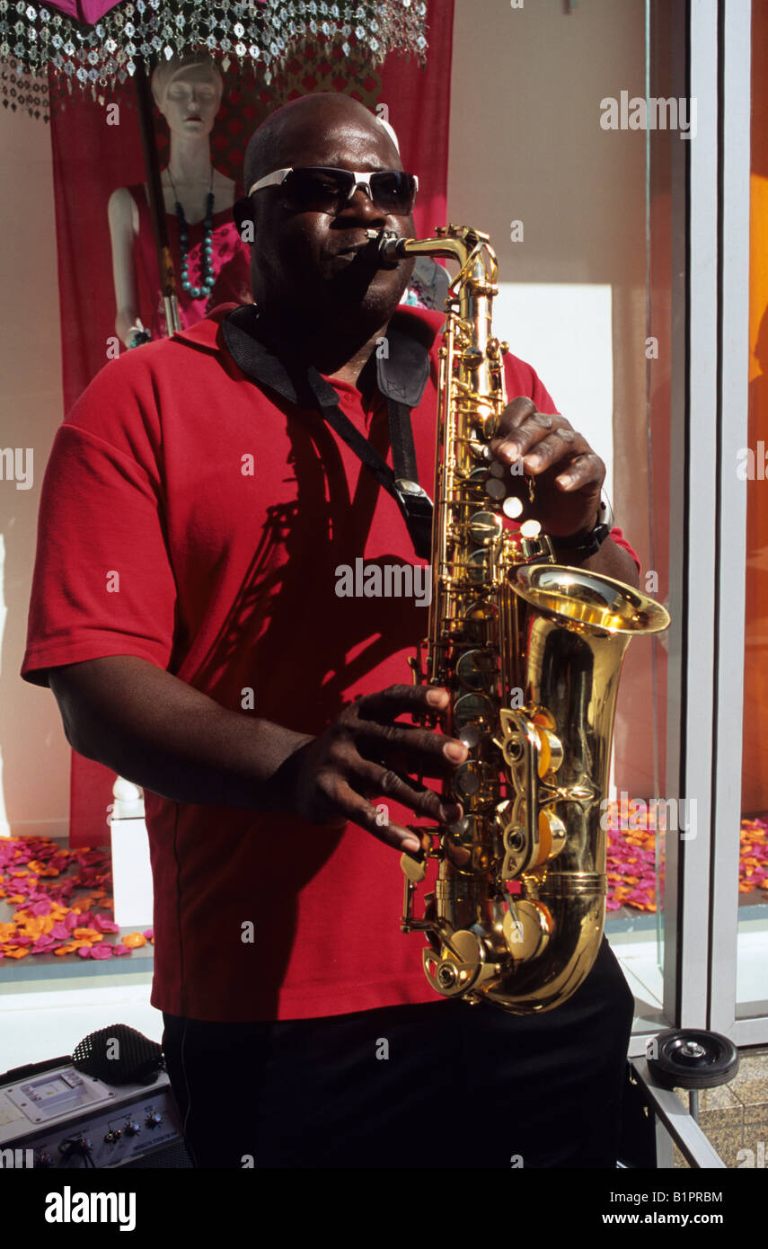 Busker Playing Saxophone In Manchester Stock Photo