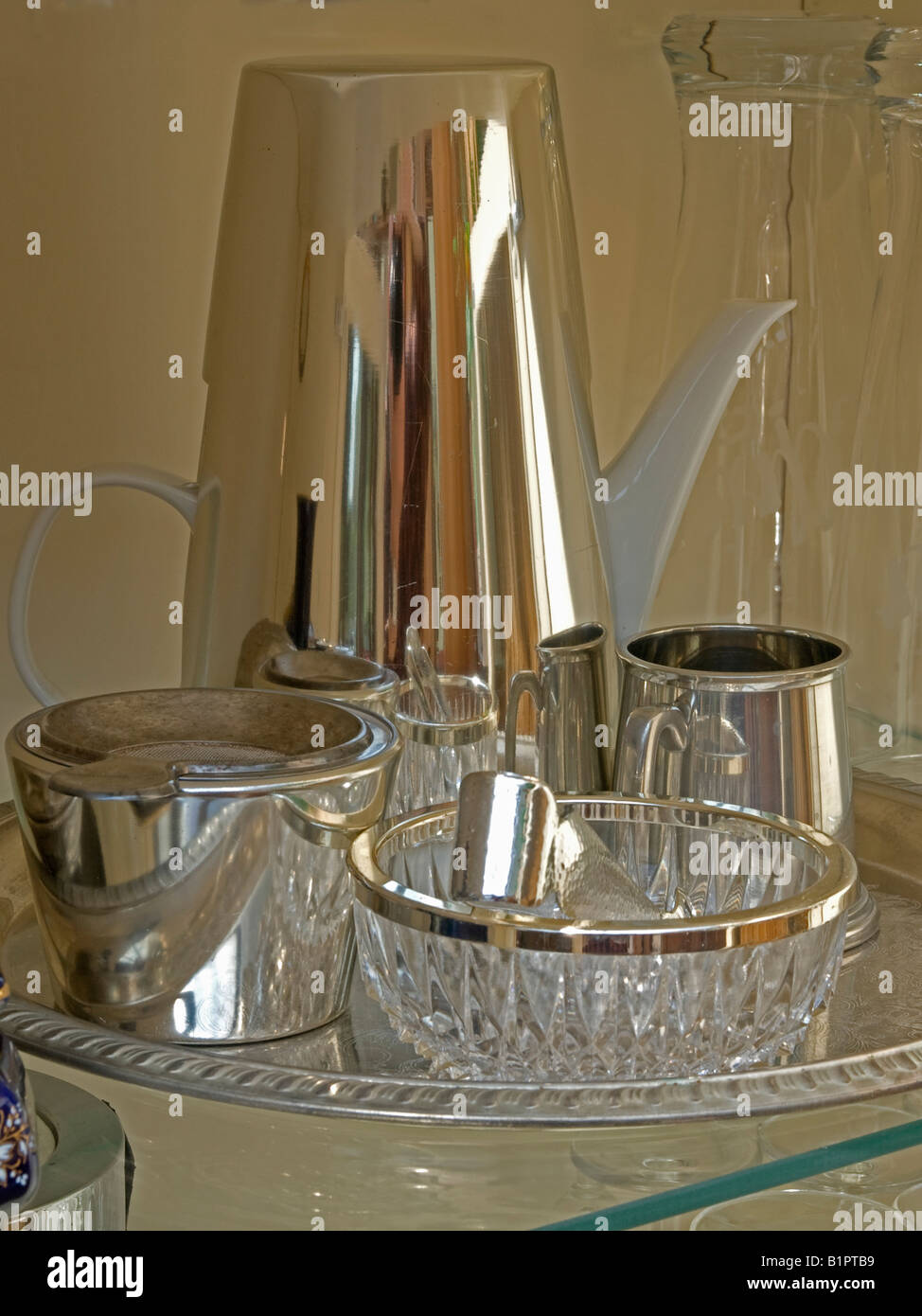 tea set of crystal glass with silver can in a cupboard Stock Photo - Alamy