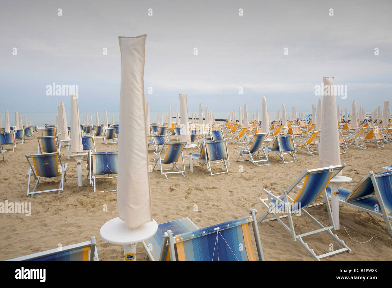 Umbrellas and recliners on the beach at Lido de Jesolo in the Venice lagoon Stock Photo