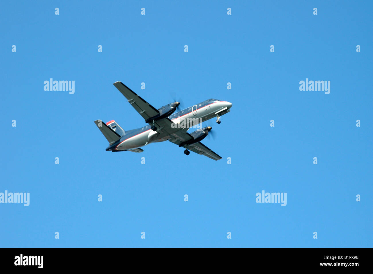 Plane in cloudless sky hi-res stock photography and images - Alamy
