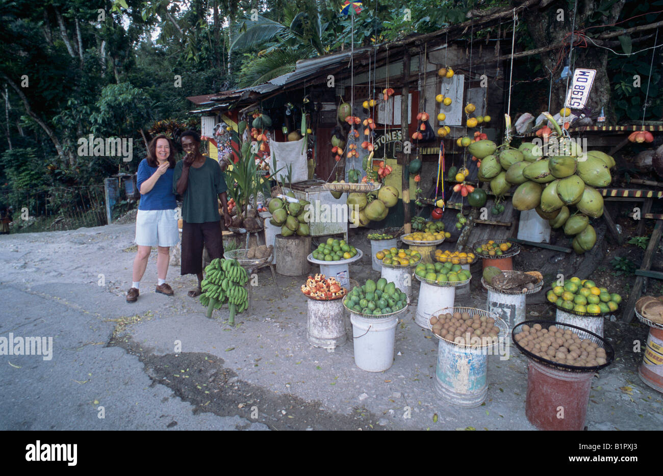 Tourist and native at Street Market Hope Bay Jamaica January 2005 Stock