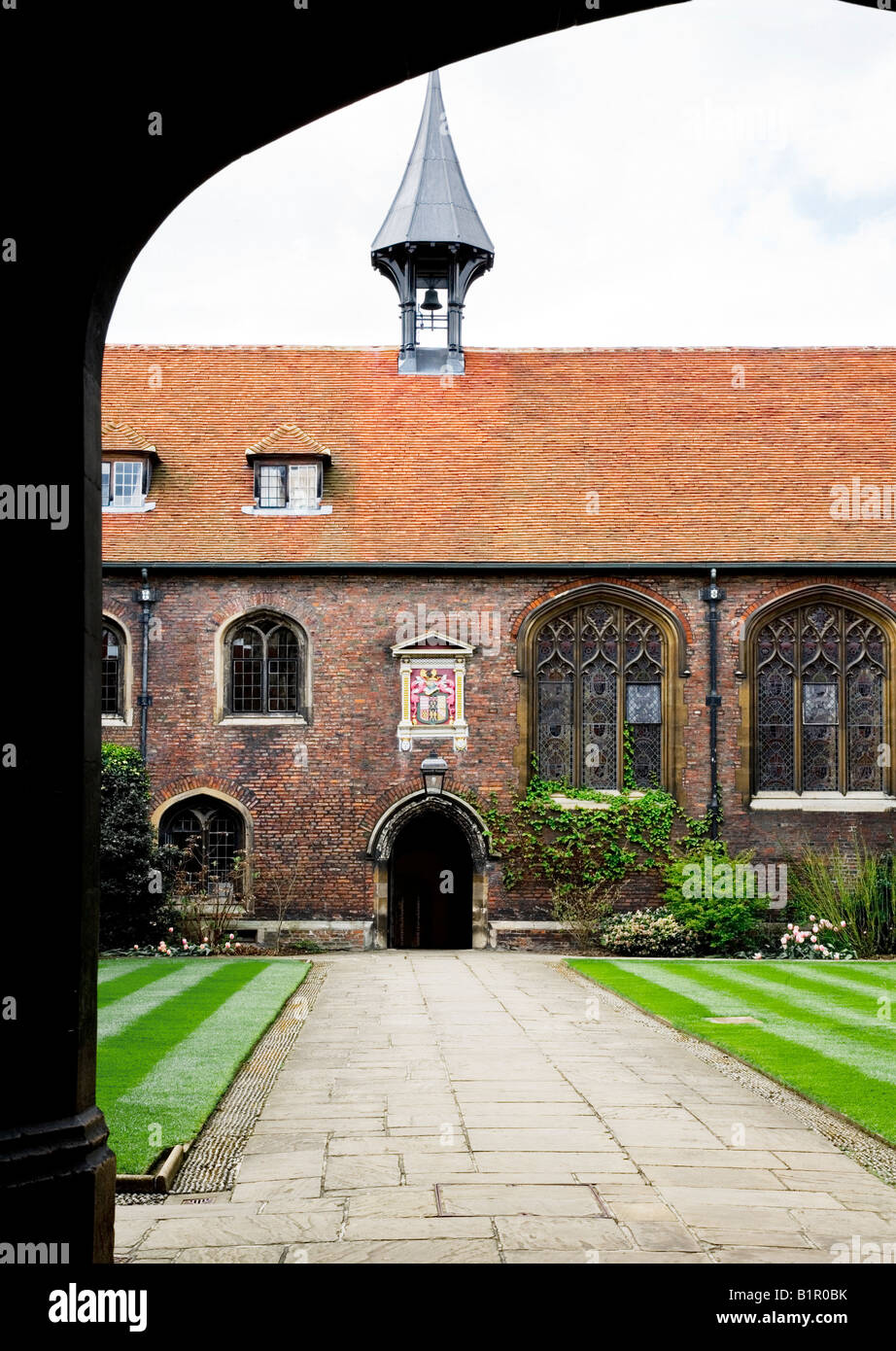Main court of Queen's College Cambridge with bell tower and coat of arms, Cambridge University, Cambridge, England, UK Stock Photo