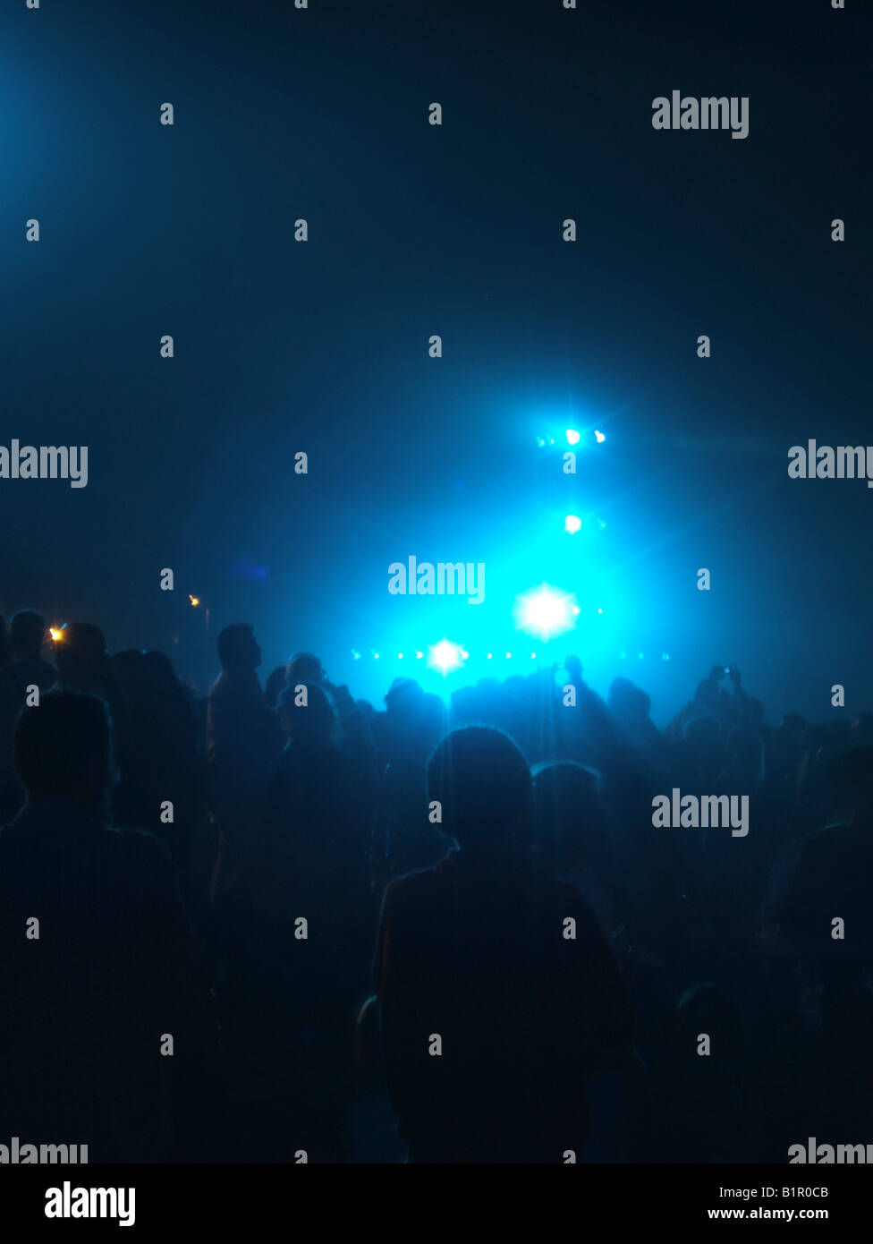 crowd of revellers at music concert gig at night Stock Photo - Alamy