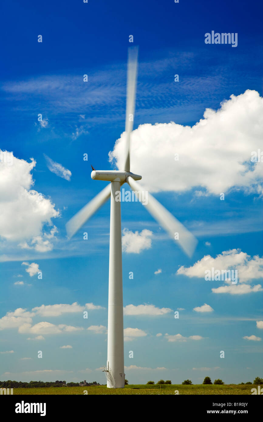 Single wind turbine against a summer blue sky with flufffy white clouds, taken at Westmill Wind Farm, Oxfordshire, England, UK Stock Photo