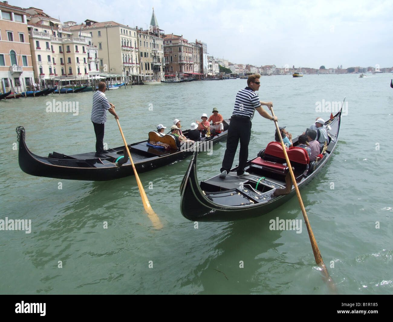 group of oriental tourists on gondola venice italy Stock Photo