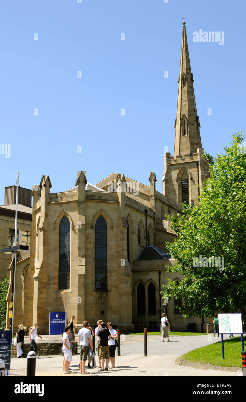 The university church on the Huddersfield university campus with students relaxing in the foreground Stock Photo