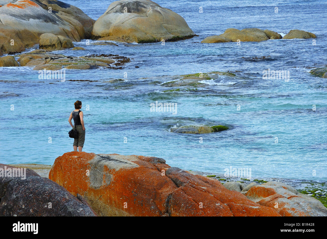 Seashore rocky solitary woman hi-res stock photography and images - Alamy