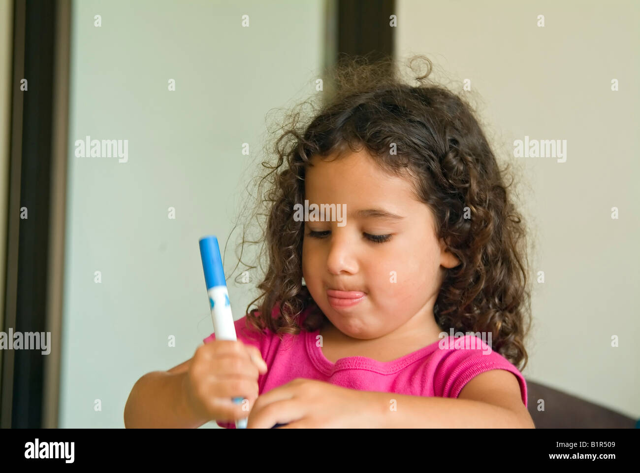 little girl painting at home Stock Photo Alamy