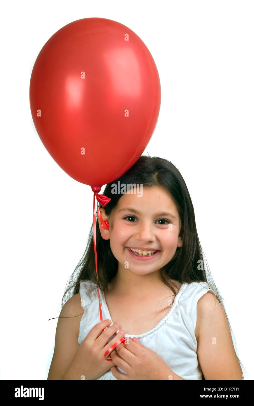 girl holding a red balloon isolated on white Stock Photo Alamy