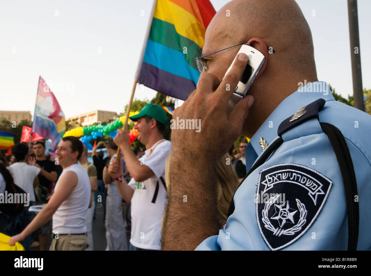 Israel Jerusalem Gay Parade 26 6 08 close up of policeman talking on mobile phone Stock Photo