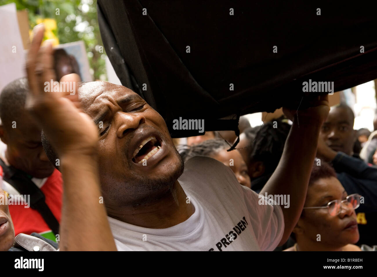 Anti Mugabe protesters carry coffin outside South Africa House London Stock Photo