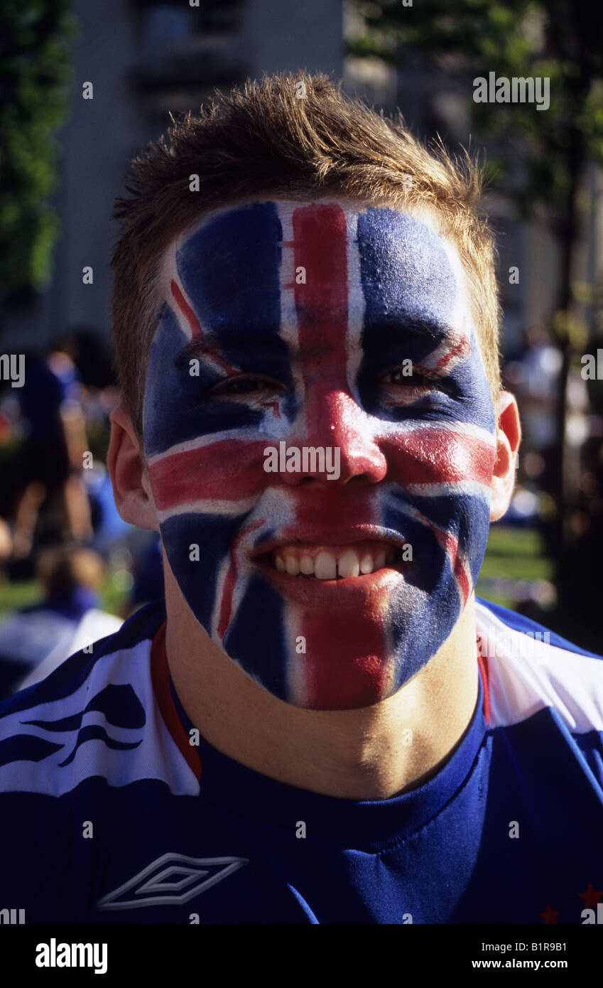 A Young Rangers Fan With His Face Painted With The Union Flag Stock Photo