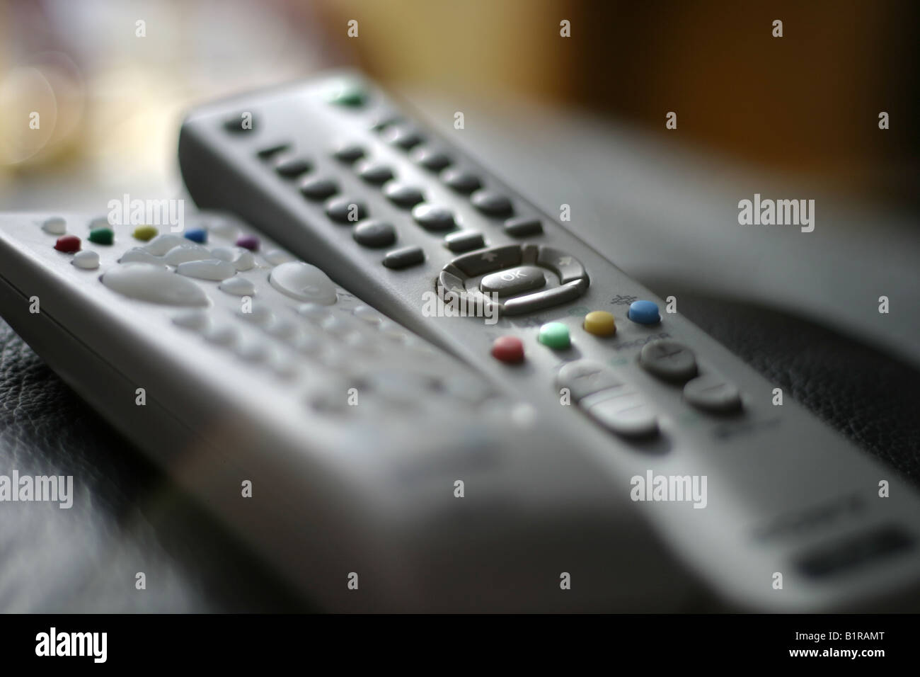 two remotes resting Stock Photo