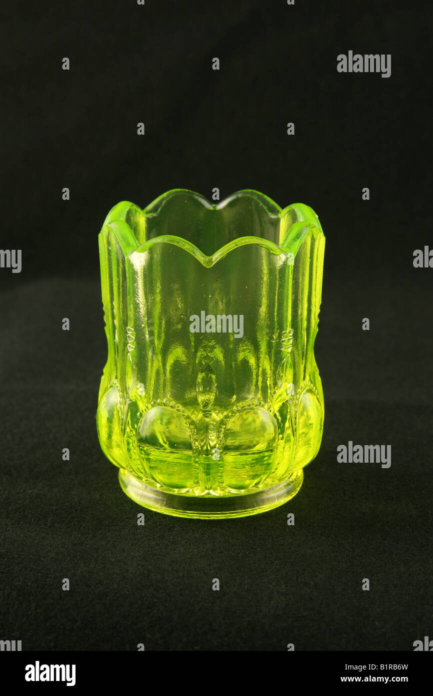 Uranium or vaseline glass toothpick jar shown under normal lighting. Stock Photo
